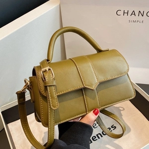 Olive green vintage top-handle crossbody bag with leather texture and detachable strap