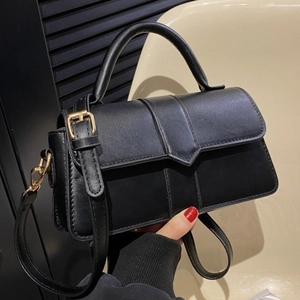 Chic black matte PU leather crossbody bag with top handle and gold hardware in 45-degree view