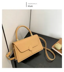 Khaki rectangular crossbody handbag with golden oval lock and adjustable strap
