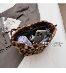 Detailed interior of leopard print bucket bag showing spacious storage for daily items
