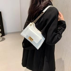 Chic white rectangular crossbody bag with gold chain strap and metallic buckle closure