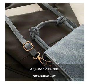Detail showing the adjustable gold buckle and knotted handle of this denim-style bag