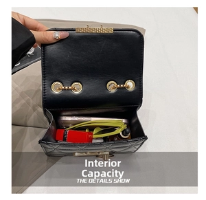 Internal view of black quilted mini bag showing capacity for phone and cosmetics