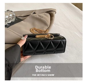 Detail shot of the reinforced wear-resistant base and quilted PU leather on the black bag