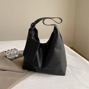 Minimalist black matte leather Hobo bag with adjustable shoulder strap and small pendant pouch