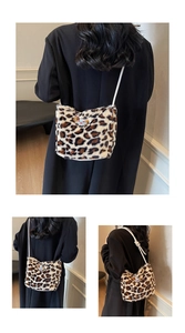 Detail of leopard print plush bucket bag with cute cartoon patch and rope shoulder strap