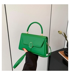 Chic green flap handbag with golden clasp and adjustable shoulder strap for women