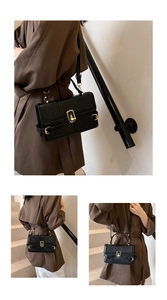 Close-up of crocodile pattern PU leather with elegant gold metal clasp and stitching