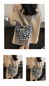 Macro detail of plush leopard print faux fur shoulder bag with cute cartoon patch