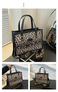 Detail of the brown leopard print tote bag featuring a black strap and golden hardware