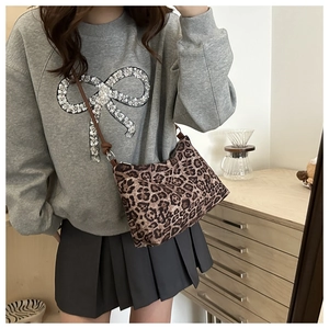 Leopard print crossbody bag for women featuring slim brown straps and classic pattern