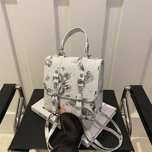 White faux leather shoulder bag with grey butterfly print and dual straps