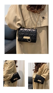 Detailed views of a black quilted chain crossbody bag with gold hardware buckle detail