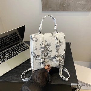 White butterfly print mini backpack with vintage celestial patterns and buckle straps