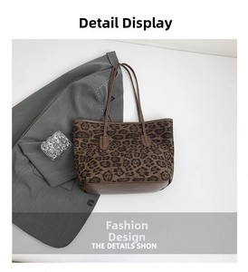 Close-up of leopard print tote bag featuring dark brown leather straps on a white background