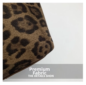 Close-up of leopard print fabric detail showing high-quality texture on a large tote bag