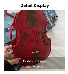 Detail of red violin-shaped crossbody bag featuring brown neck and golden rivet accents