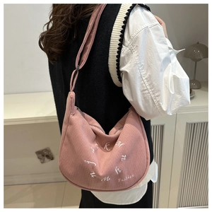 Pink corduroy crescent tote bag detail with white fashion letter embroidery