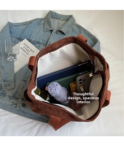 Interior view of large brown corduroy tote bag showing spacious capacity for daily items