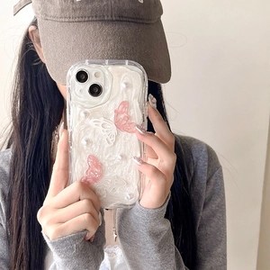 Clear iPhone case with 3D resin butterflies and pearls held by a model on plain background