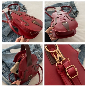 Detail view of red violin-shaped PU leather bag showing metal hardware and interior capacity