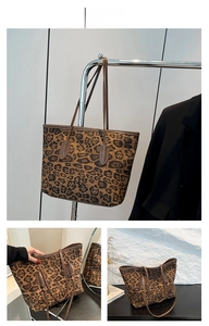 Detail view of large leopard print tote bag with durable leather shoulder straps