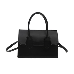 Chic black matte synthetic leather handbag with a top handle and shoulder strap