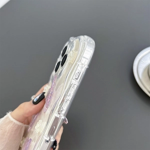 Detail of silver phone case with 3D purple butterflies and white flowers for iPhone