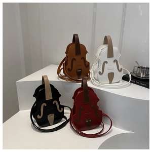 Detailed view of violin-shaped crossbody bags in brown, white, black and dark red leather