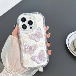 Detail showing 3D holographic butterflies and floral accents on wavy pearl iPhone case