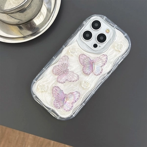 Detail of 3D iridescent butterflies and white floral accents on iPhone case with glitter