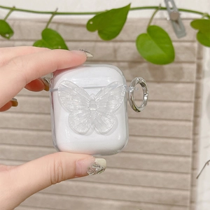 Detail of clear AirPods case with 3D butterfly pattern and silver metal carabiner ring