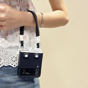 Black leather Galaxy Z Flip 5 case with contrast hand strap and cute ear accents