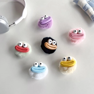 Plush monster phone grip set in seven colors displayed on minimalist white background