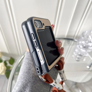 Detail of Galaxy Z Flip case with orange woven lanyard and decorative alphabet beads