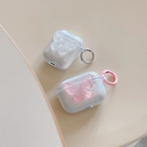 Clear AirPods case with 3D butterflies and metal carabiner shown from a high-angle view