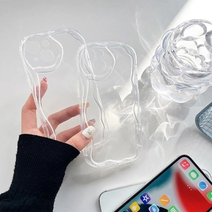 Macro shot of two transparent wavy-edge protective cases with reinforced lens protection