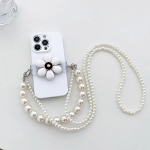 Macro shot of white matte phone case with floral stand and luxury pearl chain strap