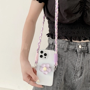 Detail of crossbody phone case with a purple 3D flower grip and braided strap