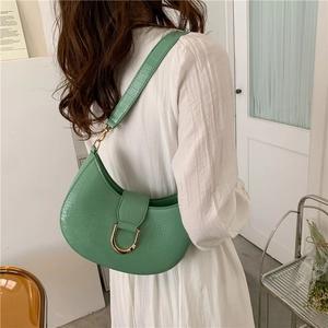 Retro green crocodile embossed half-moon crossbody bag with gold horseshoe buckle closure
