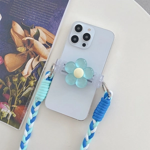 Detail of adjustable woven phone strap and floral clip in blue and white tones