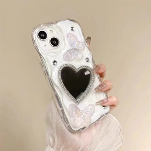 White butterfly iPhone case with heart-shaped mirror and sparkling rhinestone accents