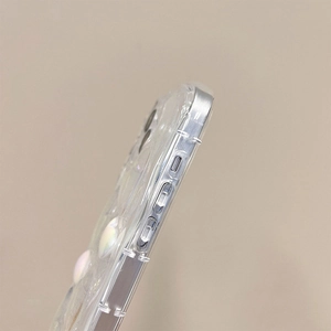 Detailed side view of wave texture and heart embellishment on a clear iPhone case