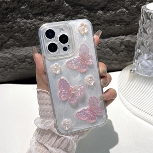 Transparant iPhone hoesje met 3D glittervlinders en parels vastgehouden in hand