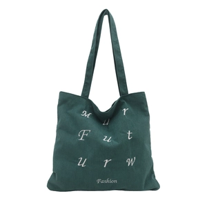 Minimalist dark green corduroy tote bag with vintage texture and white embroidery