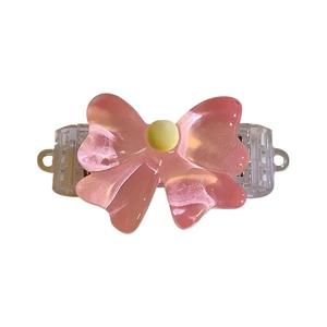 Pink bow phone clip with adjustable strap and translucent resin bow ornament