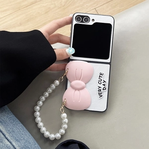 Pink bow white folding phone case for Samsung Z Flip 5 with elegant pearl hand strap