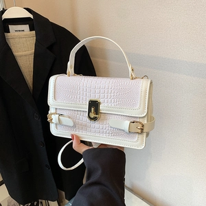 White faux crocodile skin crossbody bag with gold buckle and top handle for women