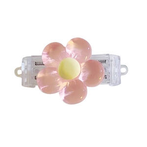 Pink floral claw clip with translucent petals and clear grip for hair styling