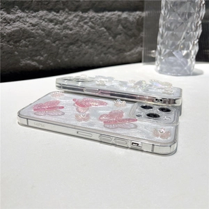 Detail van 3D-harsvlinders en glitterafwerking op transparante iPhone-hoesjes